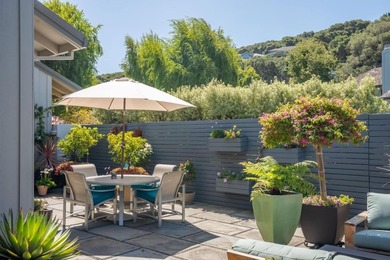 This exquisitely updated townhome enjoys privacy, sunshine, and - photo 34