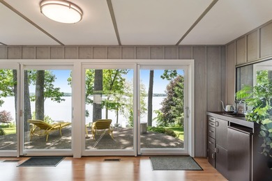 This 4-bedroom, 3-bath midcentury lake home offers 100 feet of - photo 16