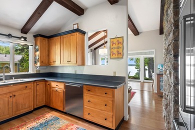 This 4-bedroom, 3-bath midcentury lake home offers 100 feet of - photo 25