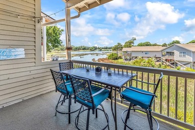 Exceptional marsh-front views, a spacious two-story layout, and - photo 27