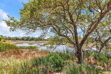 Exceptional marsh-front views, a spacious two-story layout, and - photo 30