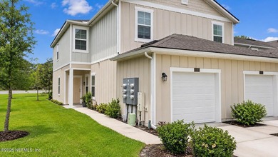 Welcome to this beautiful and nearly new townhome in the highly - photo 1