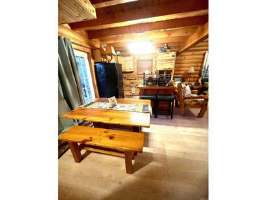 A true Abe Lincoln log home featuring 2 bedrooms, one up, one - photo 6