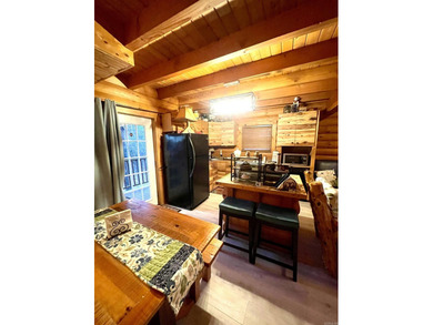 A true Abe Lincoln log home featuring 2 bedrooms, one up, one - photo 7