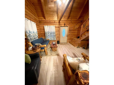 A true Abe Lincoln log home featuring 2 bedrooms, one up, one - photo 8