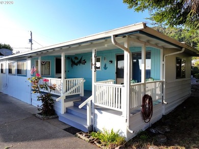 Coastal living at an unbeatable value! This charming 2-bedroom - photo 1