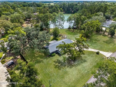 Set on 1.32 cleared, unrestricted acres in the highly - photo 3