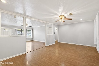 This well-maintained 3-bedroom brick home in Long Beach offers a - photo 11