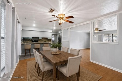 This well-maintained 3-bedroom brick home in Long Beach offers a - photo 12