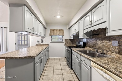 This well-maintained 3-bedroom brick home in Long Beach offers a - photo 13