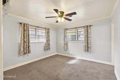 This well-maintained 3-bedroom brick home in Long Beach offers a - photo 16