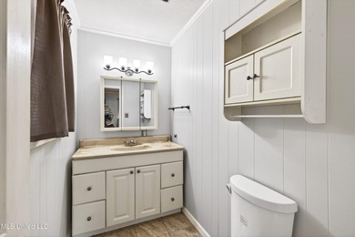 This well-maintained 3-bedroom brick home in Long Beach offers a - photo 18