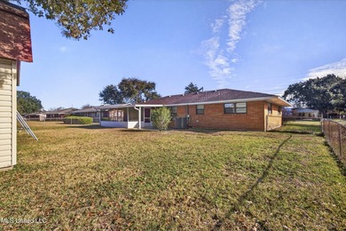 This well-maintained 3-bedroom brick home in Long Beach offers a - photo 34