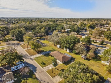 This well-maintained 3-bedroom brick home in Long Beach offers a - photo 36