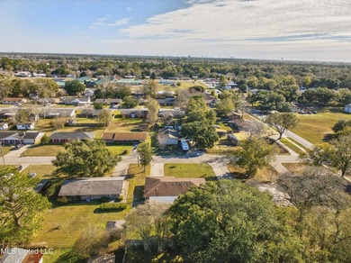 This well-maintained 3-bedroom brick home in Long Beach offers a - photo 37