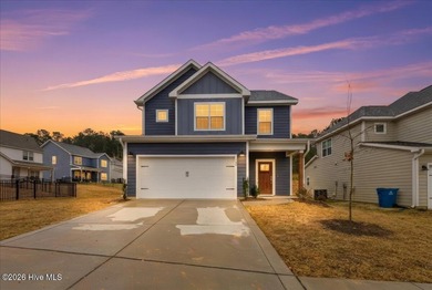 Welcome home! This well-kept two-story home features a bright