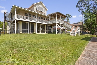 Tucked away on a peaceful waterfront canal in the desirable - photo 1