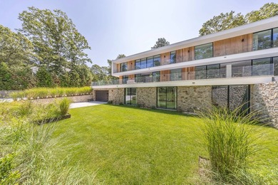 Set amidst lush greenery in one of the Hamptons' most serene - photo 2