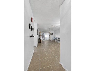 Welcome home to this inviting residence featuring tile floors & - photo 6
