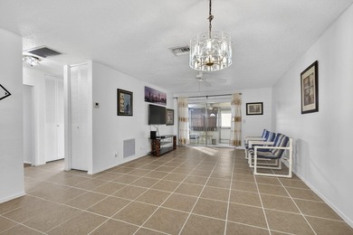 Welcome home to this inviting residence featuring tile floors & - photo 9