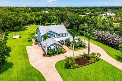Situated on nearly 2 acres in the gated golf and equestrian - photo 1