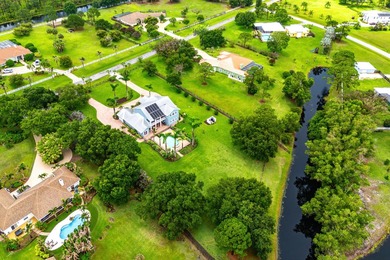 Situated on nearly 2 acres in the gated golf and equestrian - photo 6