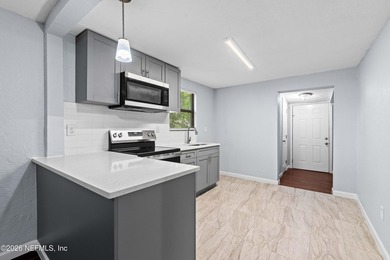 Move-in ready concrete block single-family home! Freshly - photo 3