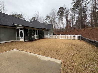 Tucked away on a serene two-acre wooded lot, this stunning