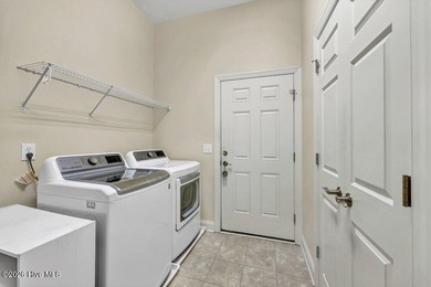 Welcome to 5410 Reserve Drive, a beautifully designed 3-bedroom