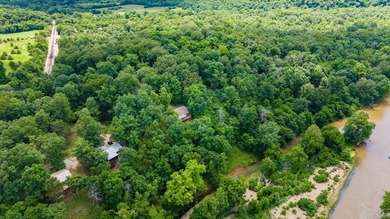 Experience direct Spring River frontage on 3.05 acres located on - photo 26