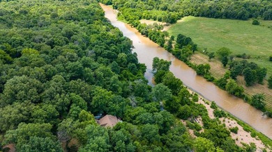 Experience direct Spring River frontage on 3.05 acres located on - photo 28