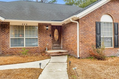 Classic all-brick home perfectly positioned on Hole 1 of the - photo 3