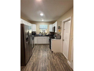 This home is in an established neighborhood, just minutes from - photo 4