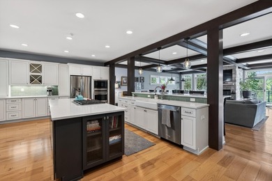 Completely reimagined and thoughtfully expanded, this Lake - photo 21