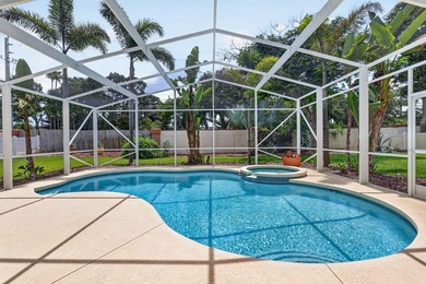 Palm trees sway over your private, screened pool at this move-in - photo 2
