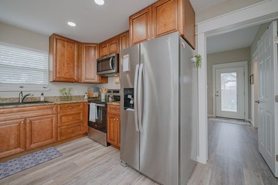 Nestled in the waterfront community of Holiday Beach, this - photo 19