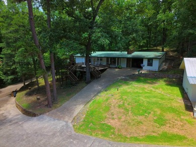 Enjoy seasonal views of Lake Greeson from this 3-bedroom, 2-bath - photo 27