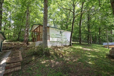 Enjoy seasonal views of Lake Greeson from this 3-bedroom, 2-bath - photo 31