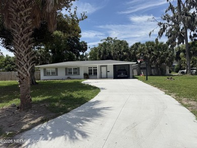 Welcome home to this beautifully updated 3-bedroom plus family - photo 1