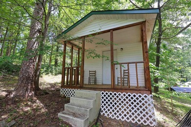 Enjoy seasonal views of Lake Greeson from this 3-bedroom, 2-bath - photo 32