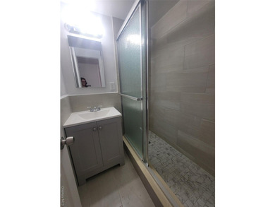 THIS UNIT HAS A SPECTACULAR VIEW OF THE CITY SKYLINE, LOCATED IN - photo 12