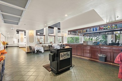 Located in the desirable Pine Island Ridge / Live Oak community