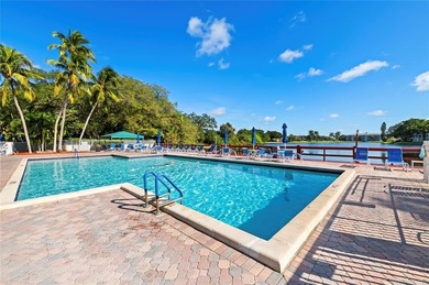 Located in the desirable Pine Island Ridge / Live Oak community