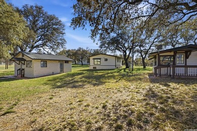 564' of Lake Buchanan shoreline. 6.3 acres. Eleven cabins. This - photo 10