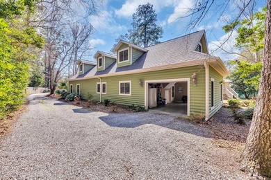 Situated beneath towering oak trees on a secluded one-acre - photo 34