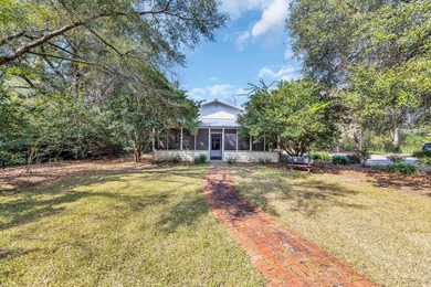 Situated beneath towering oak trees on a secluded one-acre - photo 45