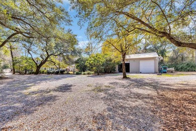 Situated beneath towering oak trees on a secluded one-acre - photo 46