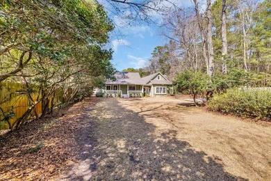 Situated beneath towering oak trees on a secluded one-acre - photo 50