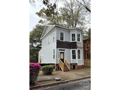 217 E 38th St is a completely gutted, two-story single-family - photo 1