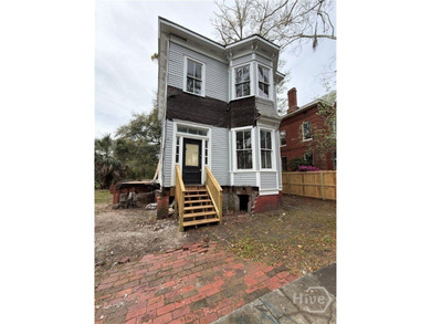 217 E 38th St is a completely gutted, two-story single-family - photo 2